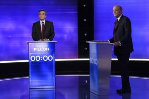 French politicians Alain Juppe (R) and Francois Fillon attend the third prime-time televised debate as they campaign in the second round for the French center-right presidential primary election in Paris, France, November 24, 2016. REUTERS/Eric Feferberg/Pool